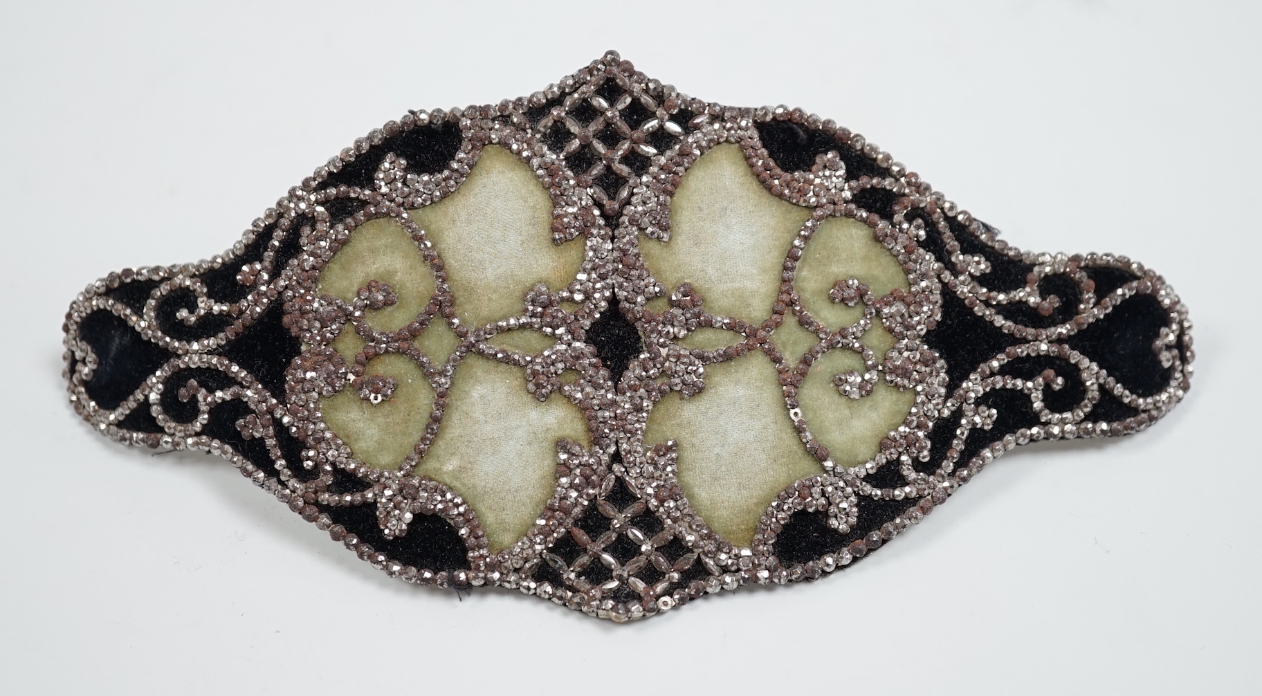 A 19th century cut steel lady’s belt buckle, 19cm wide